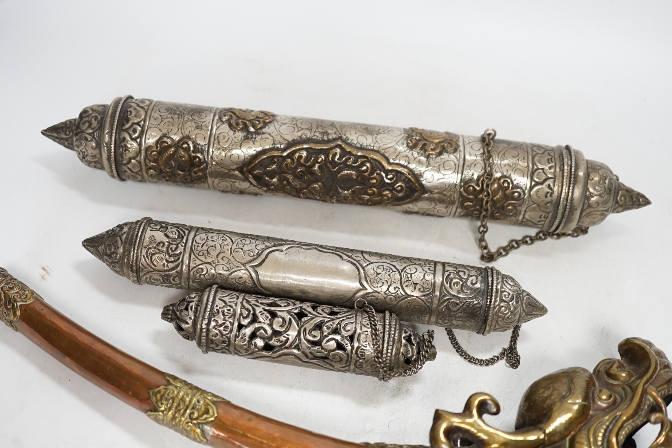 Three Tibetan scroll holders and a 'dragon' trumpet, trumpet 38cm long. Condition - fair to good